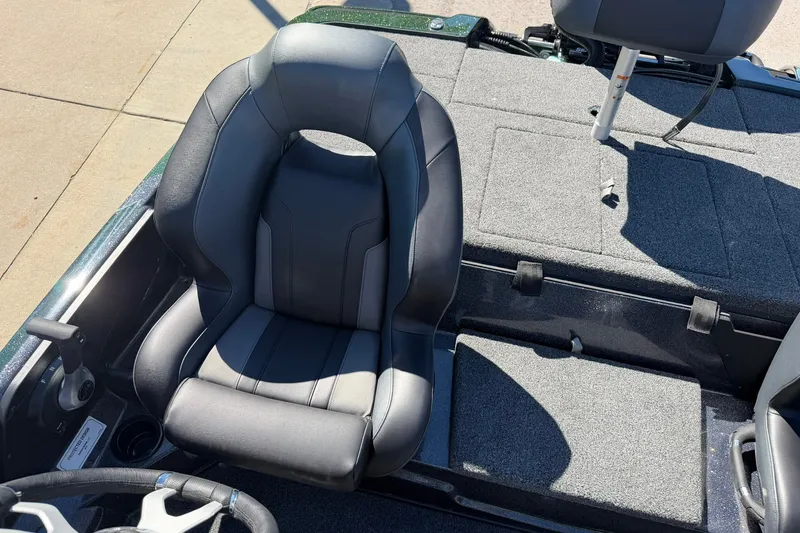Slide: The Image of 2027 Nitro Z18 XL Pro boat interior with sleek black seat and carpeted deck. - 20