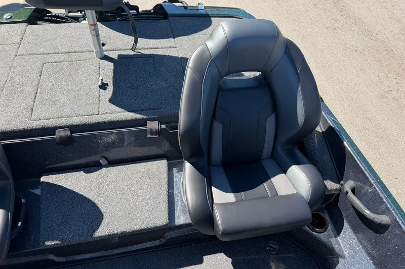 Slide: The Image of Nitro Z18 XL Pro 2027 boat seat with gray upholstery and textured flooring. - 21