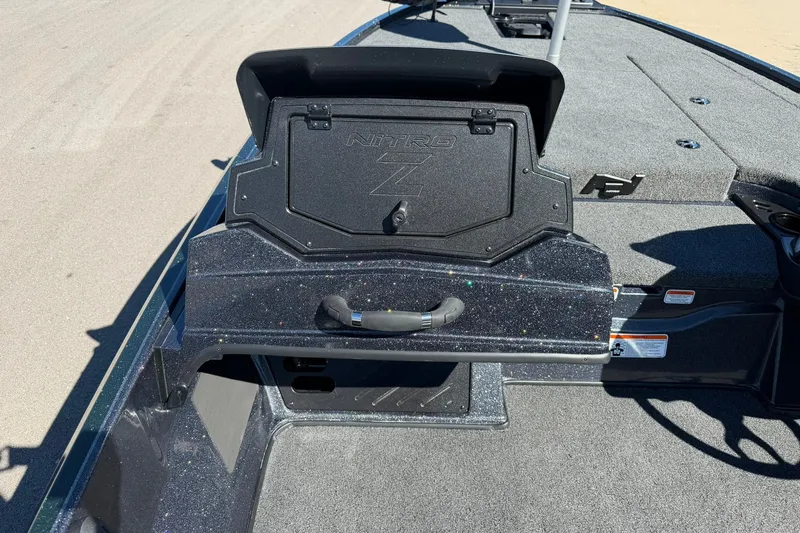 Slide: The Image of 2027 Nitro Z18 XL Pro boat deck with storage compartment open. - 25