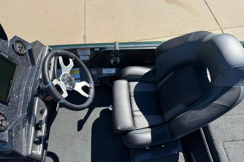 Slide: The Image of 2027 Nitro Z18 XL Pro boat cockpit with steering wheel and comfortable seating. - 24