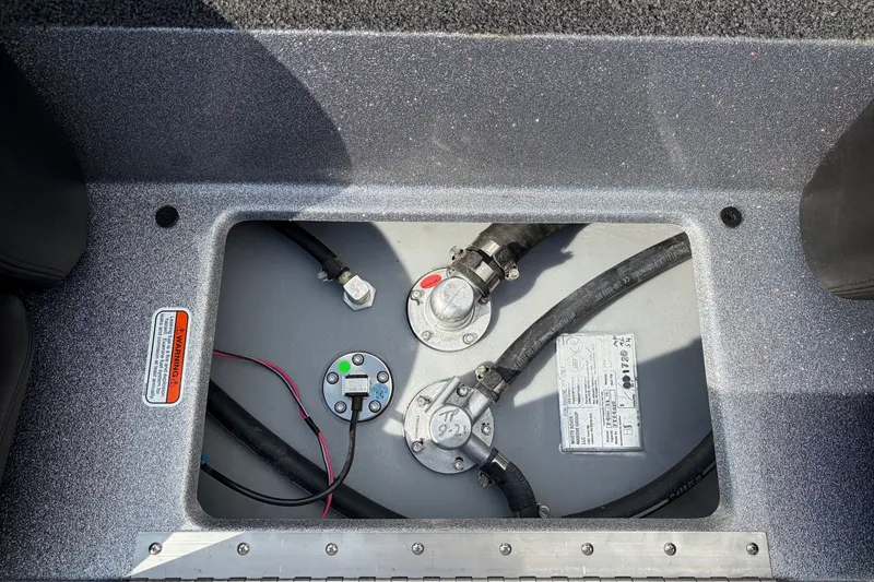 Slide: The Image of Fuel compartment of a 2027 Nitro Z17 boat, showing fuel lines and gauges. - 16