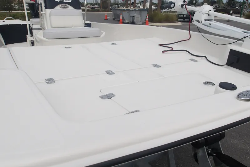 Slide: The Image of 2027 Mako Pro Skiff 17 CC boat deck with seating and equipment. - 3