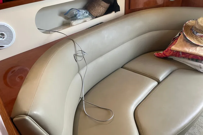 Slide: The Image of Interior of 2007 Cruisers Yachts 280 CXi Express with beige leather seating and storage. - 9