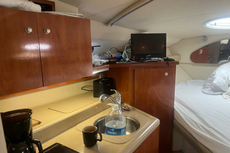 Slide: The Image of Interior of 2007 Cruisers Yachts 280 CXi Express with kitchenette and bed. - 4
