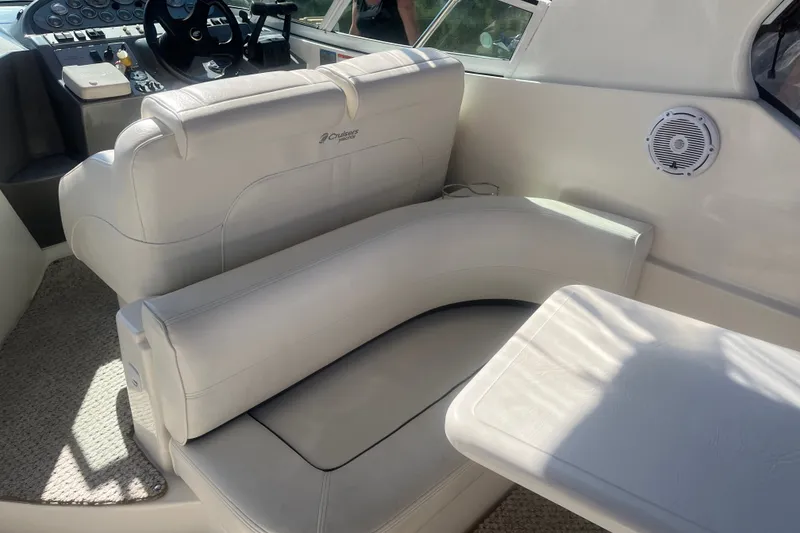 Slide: The Image of 2007 Cruisers Yachts 280 CXi Express interior with white seating and control panel. - 18
