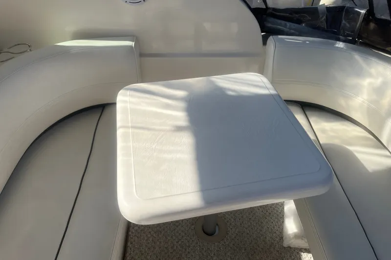 Slide: The Image of Interior seating area of 2007 Cruisers Yachts 280 CXi Express with white upholstery. - 16