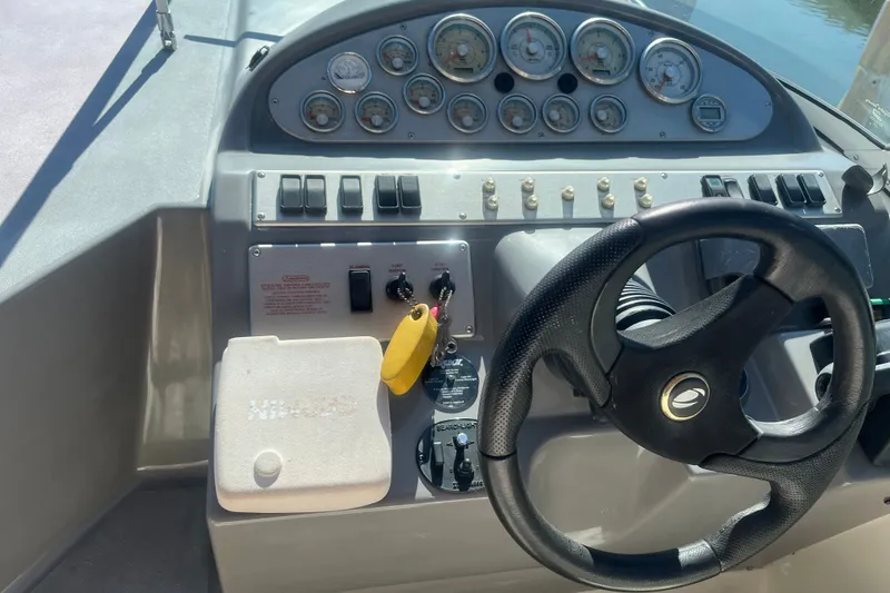 Slide: The Image of Dashboard of 2007 Cruisers Yachts 280 CXi Express with steering wheel and control panel. - 13
