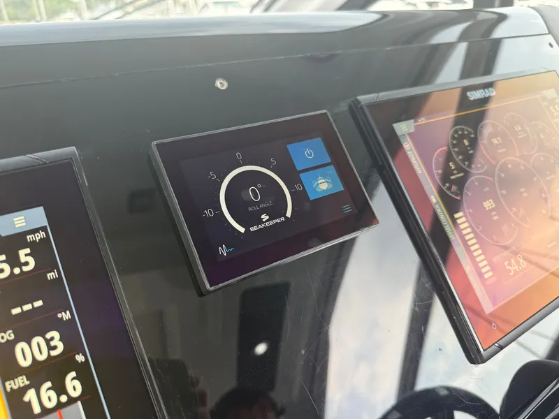 Slide: The Image of The dashboard of a 2021 Cruisers Yachts 42 GLS OB with modern instruments. - 47