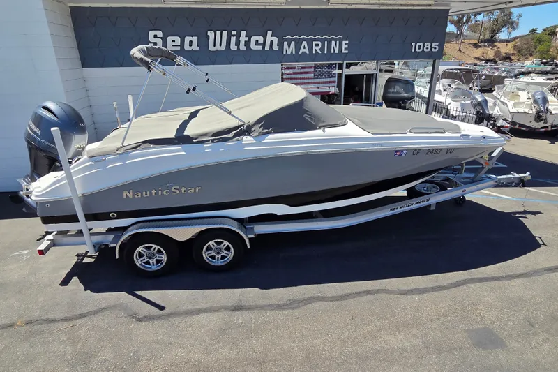 Slide: The Image of 2022 NauticStar 223 DC boat on trailer at Sea Witch Marine dealership. - 21