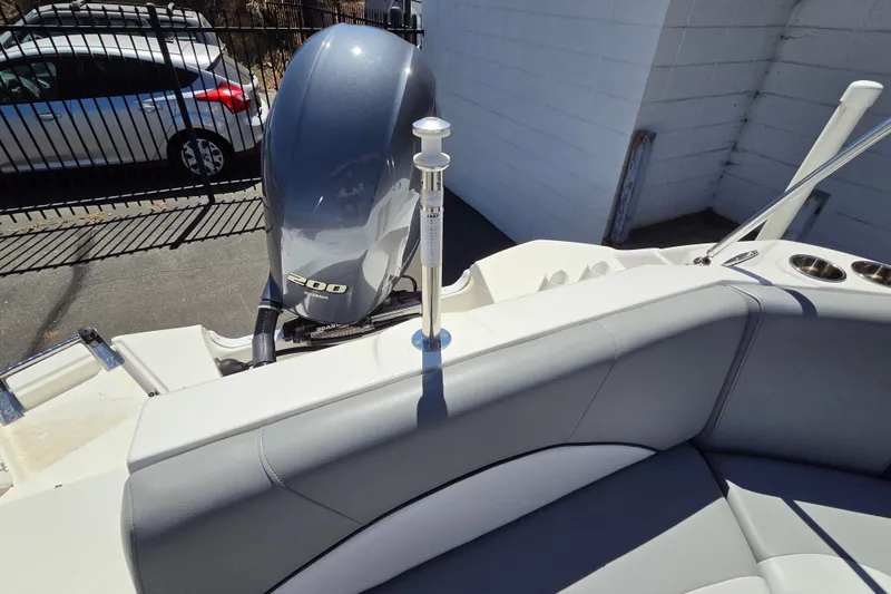 Slide: The Image of 2022 NauticStar 223 DC boat with Yamaha 200 engine, featuring sleek seating and cup holders. - 17