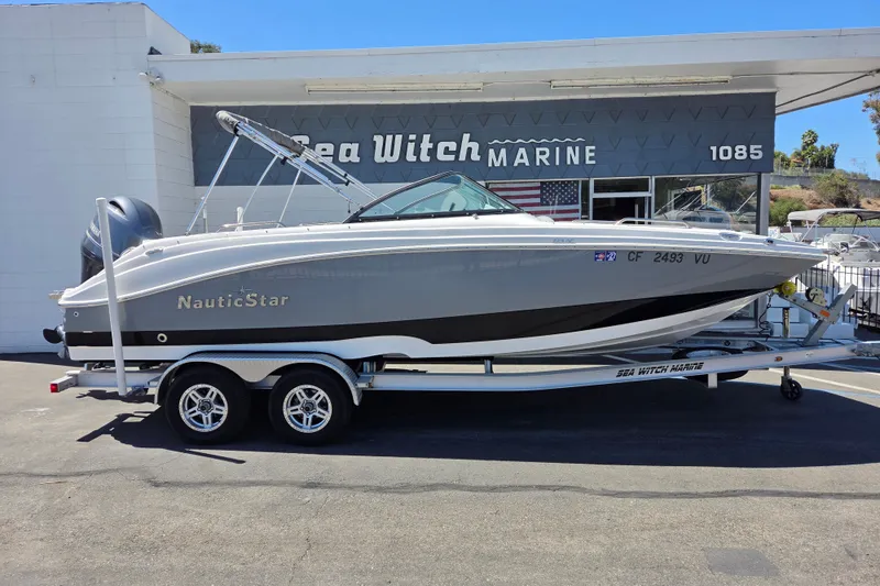 The Image of 2022 NauticStar 223 DC boat on trailer at Sea Witch Marine dealership. - 0