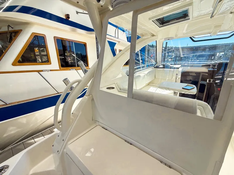 Slide: The Image of The image shows the cockpit of a 2026 Pursuit OS 325 Offshore, featuring a sleek, modern design. - 31