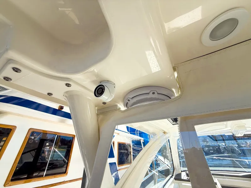 Slide: The Image of Interior view of a Pursuit OS 325 Offshore with modern speakers and lighting. - 33