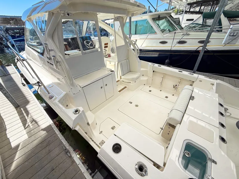 Slide: The Image of The image shows a modern boat with a spacious, open deck and comfortable seating. - 18