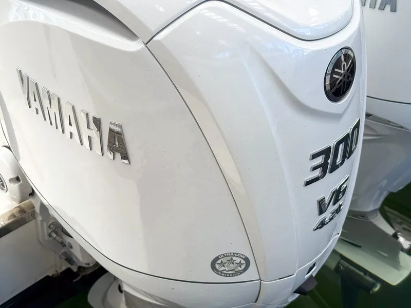 Slide: The Image of Close-up of a Yamaha 300 HP V6 outboard motor on a Pursuit OS 325 Offshore boat. - 13