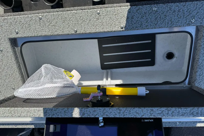 Slide: The Image of Open storage compartment in 2026 Lund 2075 Fisherman boat with fishing gear. - 20