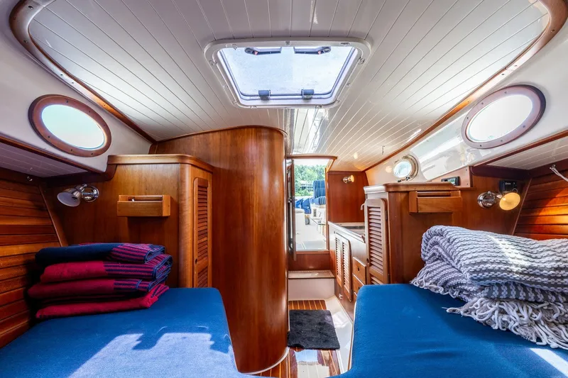 Slide: The Image of Interior of 2000 Hinckley Picnic Boat 36 Classic with cozy wooden cabin design. - 28
