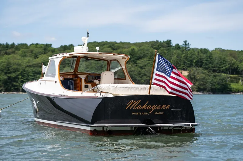 Slide: The Image of Hinckley Picnic Boat 36 Classic 2000 on water, American flag, Portland, Maine. - 2