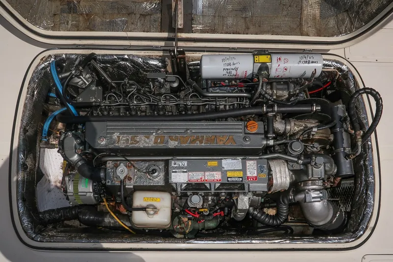 Slide: The Image of Engine compartment of a 2000 Hinckley Picnic Boat 36 Classic, featuring a Yanmar diesel engine. - 31