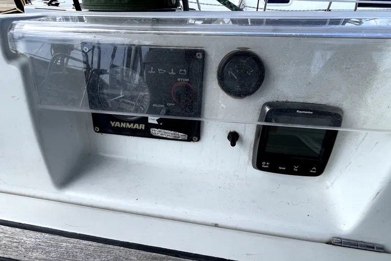Slide: The Image of Control panel of a 2006 Beneteau Oceanis 393 sailboat with Yanmar and Raymarine instruments. - 80