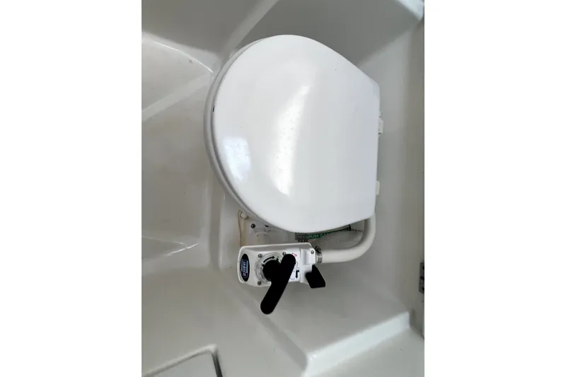Slide: The Image of Marine toilet on a 2006 Beneteau Oceanis 393 sailboat, featuring a manual pump handle. - 49