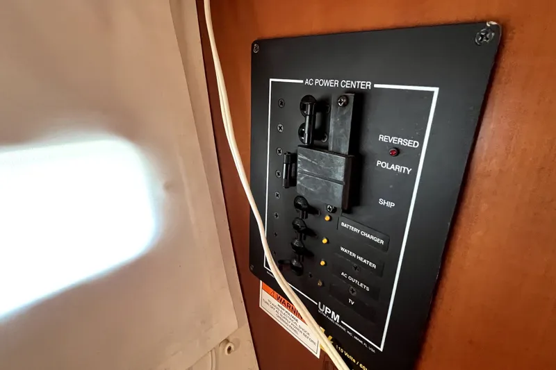 Slide: The Image of AC power center panel on a 2006 Beneteau Oceanis 393 sailboat. - 35