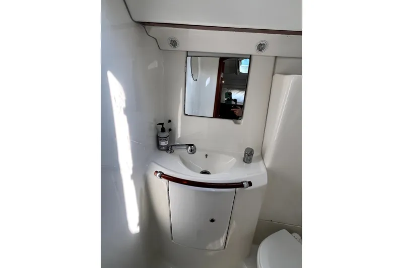 Slide: The Image of Bathroom interior of 2006 Beneteau Oceanis 393 yacht, featuring sink and mirror. - 50