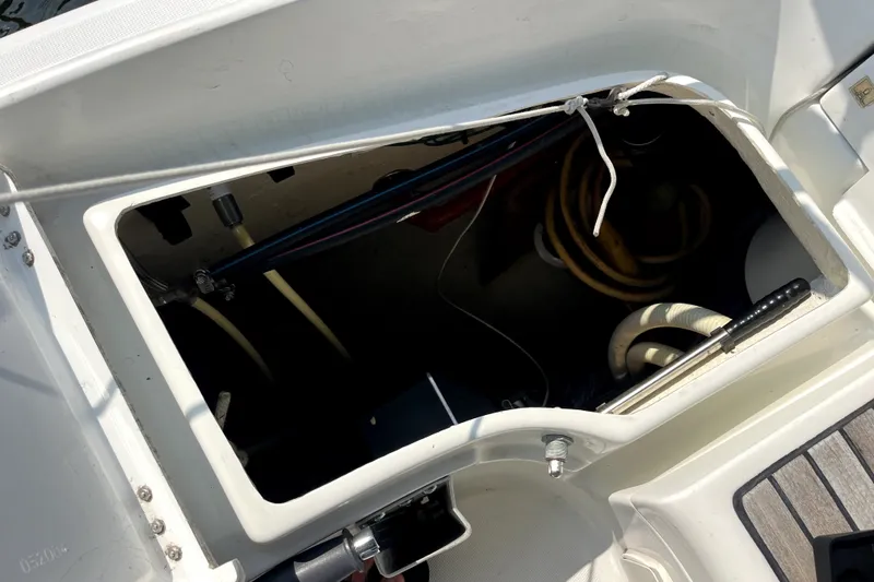Slide: The Image of Storage compartment of a 2006 Beneteau Oceanis 393 sailboat, showing ropes and equipment. - 79