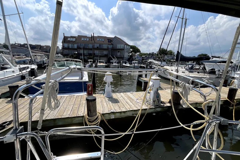 Slide: The Image of Marina view from a 2006 Beneteau Oceanis 393 sailboat, docked with other vessels. - 63