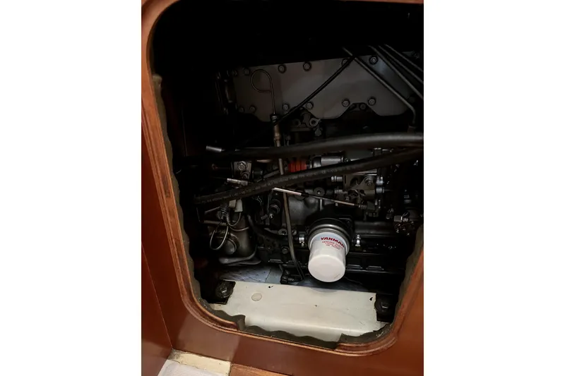 Slide: The Image of Engine compartment of a 2006 Beneteau Oceanis 393 sailboat, featuring a Yanmar filter. - 48