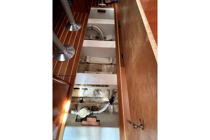 Slide: The Image of Interior view of 2006 Beneteau Oceanis 393 sailboat, showcasing underfloor storage compartments. - 47