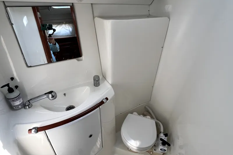 Slide: The Image of Bathroom interior of 2006 Beneteau Oceanis 393 yacht, featuring sink and toilet. - 44