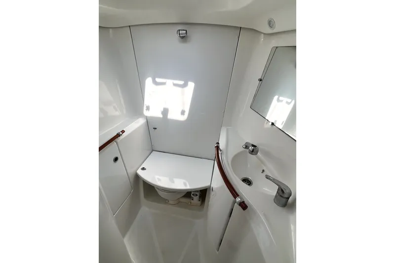 Slide: The Image of Bathroom interior of 2006 Beneteau Oceanis 393 yacht, featuring sink and toilet. - 54