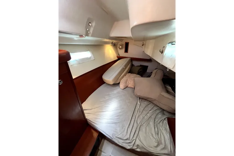 Slide: The Image of Cozy cabin interior of 2006 Beneteau Oceanis 393 sailboat with comfortable bedding. - 33