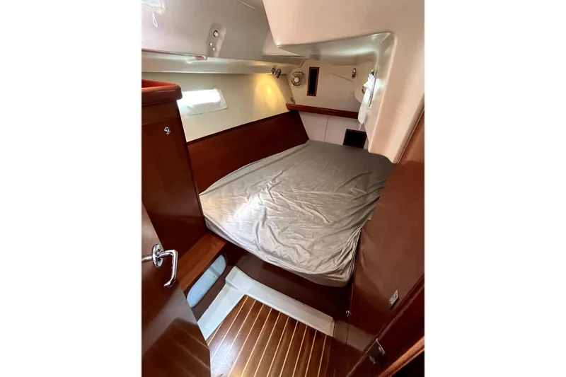 Slide: The Image of Cozy cabin interior of 2006 Beneteau Oceanis 393 sailboat with wooden finishes. - 32