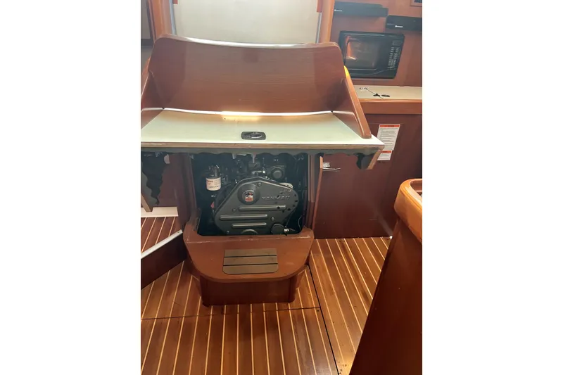 Slide: The Image of Engine compartment of a 2006 Beneteau Oceanis 393 sailboat, showcasing interior design and equipment. - 17