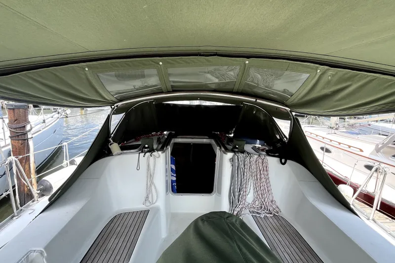 Slide: The Image of Cockpit view of 2006 Beneteau Oceanis 393 sailboat with green canopy. - 56