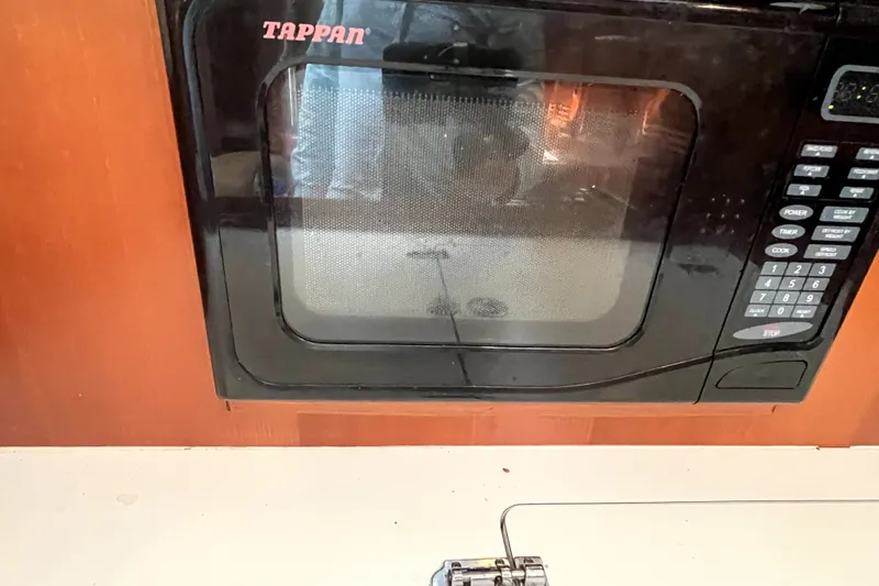Slide: The Image of Tappan microwave in the galley of a 2006 Beneteau Oceanis 393 sailboat. - 21