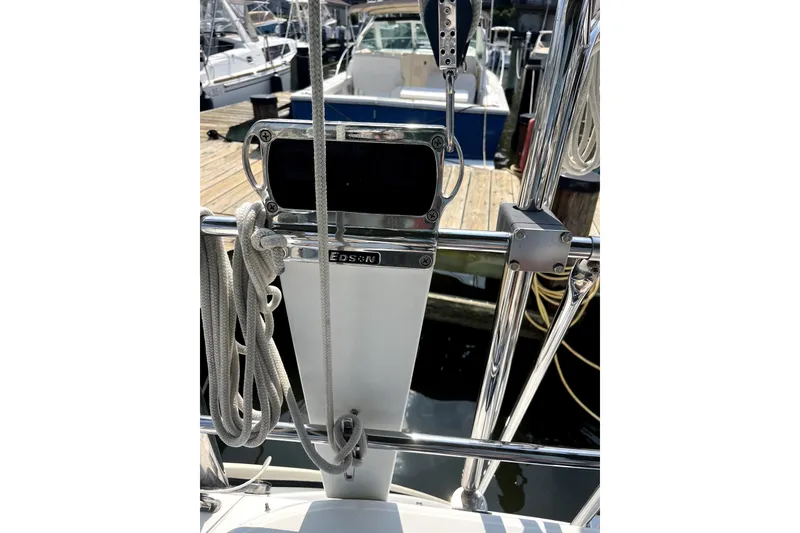Slide: The Image of Beneteau Oceanis 393 sailboat helm with ropes and Edson steering system, docked at marina. - 64