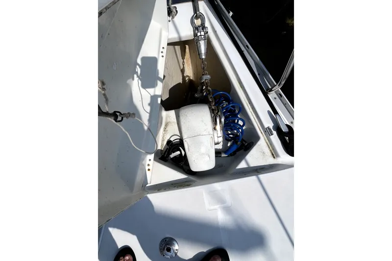 Slide: The Image of Anchor locker of 2006 Beneteau Oceanis 393 sailboat with coiled blue hose. - 66