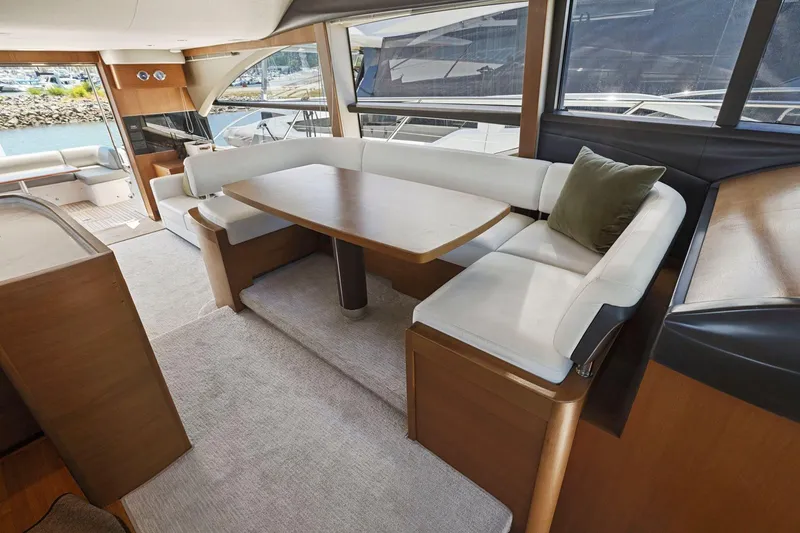 Slide: The Image of Luxurious interior of 2015 Princess 60 Flybridge Motor Yacht with elegant seating and dining area. - 24