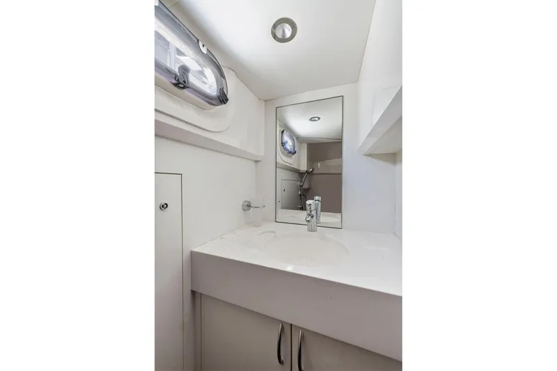 Slide: The Image of Bathroom interior of 2015 Princess 60 Flybridge Motor Yacht, featuring modern sink and mirror. - 50