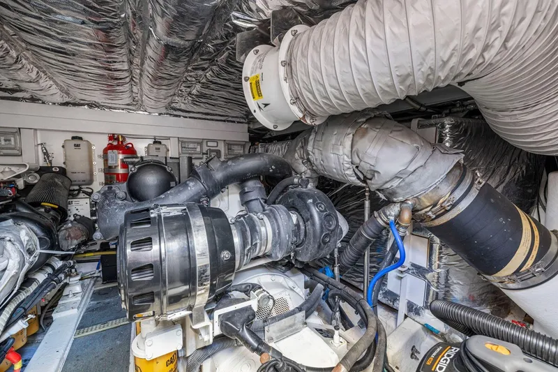 Slide: The Image of Engine room of 2015 Princess 60 Flybridge Motor Yacht, showcasing complex machinery and components. - 63