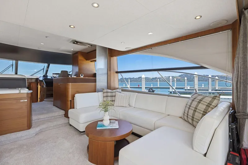 Slide: The Image of Luxurious interior of 2015 Princess 60 Flybridge Motor Yacht with elegant seating and scenic views. - 21