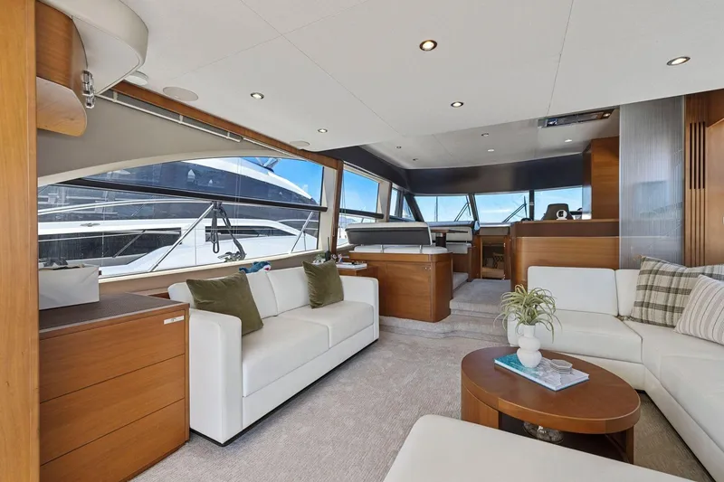 Slide: The Image of Luxurious interior of 2015 Princess 60 Flybridge Motor Yacht with elegant seating and panoramic windows. - 16