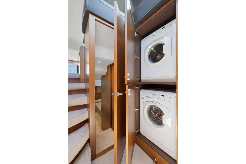 Slide: The Image of Laundry area with washer and dryer on 2015 Princess 60 Flybridge Motor Yacht. - 30