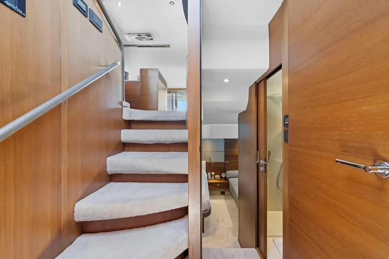 Slide: The Image of Interior of 2015 Princess 60 Flybridge Yacht with wooden stairs and modern design. - 31