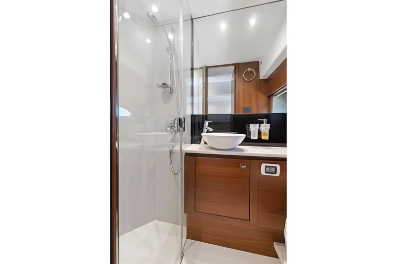 Slide: The Image of Luxurious bathroom in 2015 Princess 60 Flybridge Motor Yacht with modern fixtures and wood accents. - 47