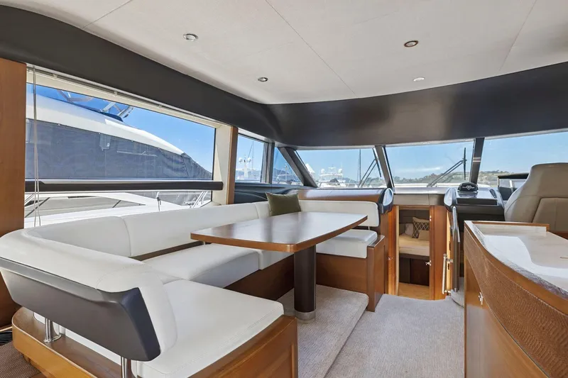 Slide: The Image of Luxurious interior of 2015 Princess 60 Flybridge Motor Yacht with elegant seating and panoramic windows. - 23