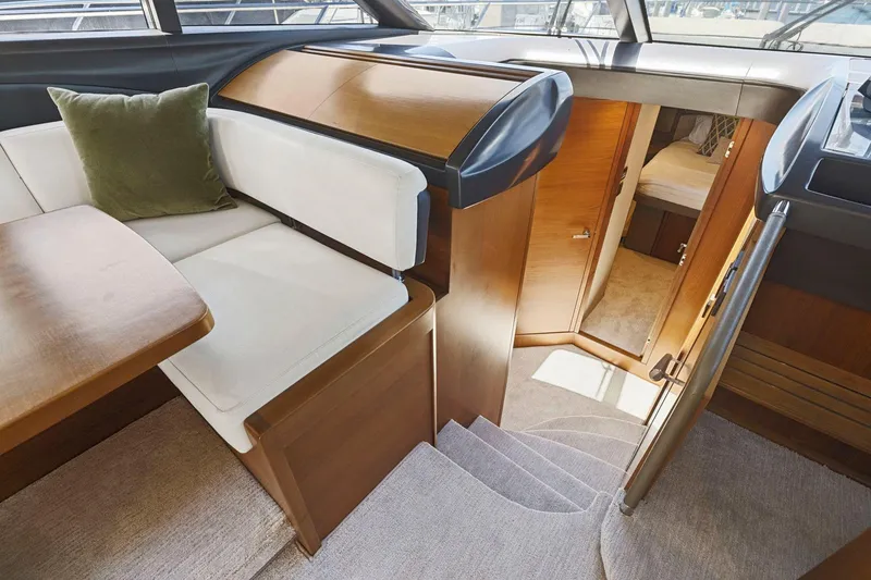 Slide: The Image of Interior of 2015 Princess 60 Flybridge Motor Yacht with elegant seating and cabin access. - 28